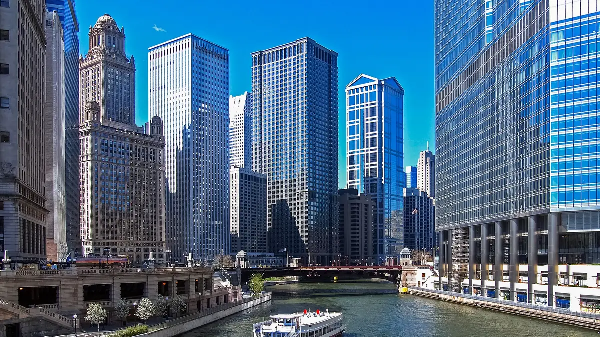 A Chicago River tour boat passes in front of Trump Tower